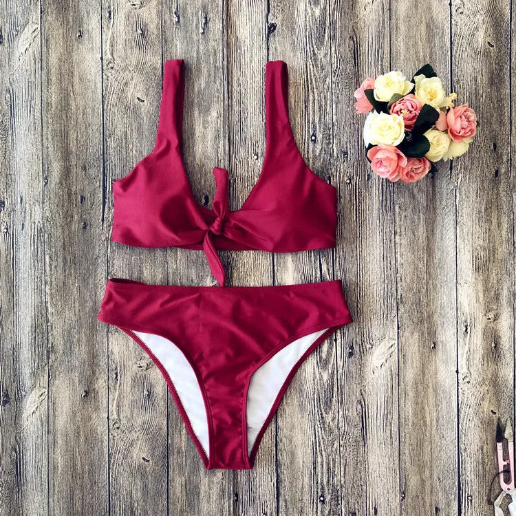 Ladies' polyester bikini set in solid red colour, showing bra top and briefs.