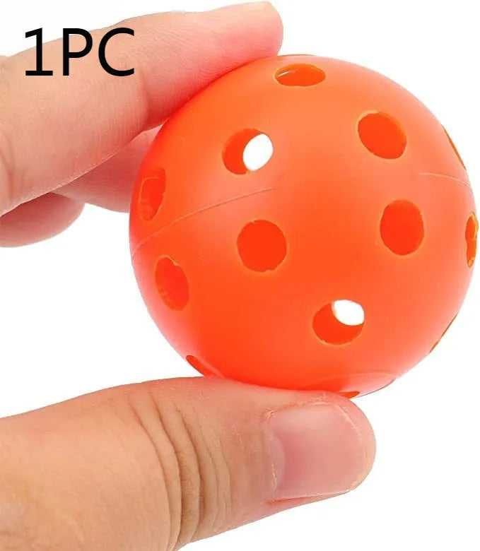 Multi-colour golf practice balls in net bag with 26-hole putting layout for skill development