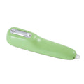 Dark green kitchen peeler with stainless steel blade stored in its tube, next to a potato.