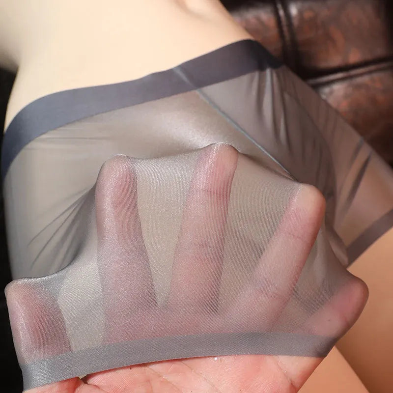 Ultra-thin transparent men's ice silk underwear boxer shorts in light grey colour.