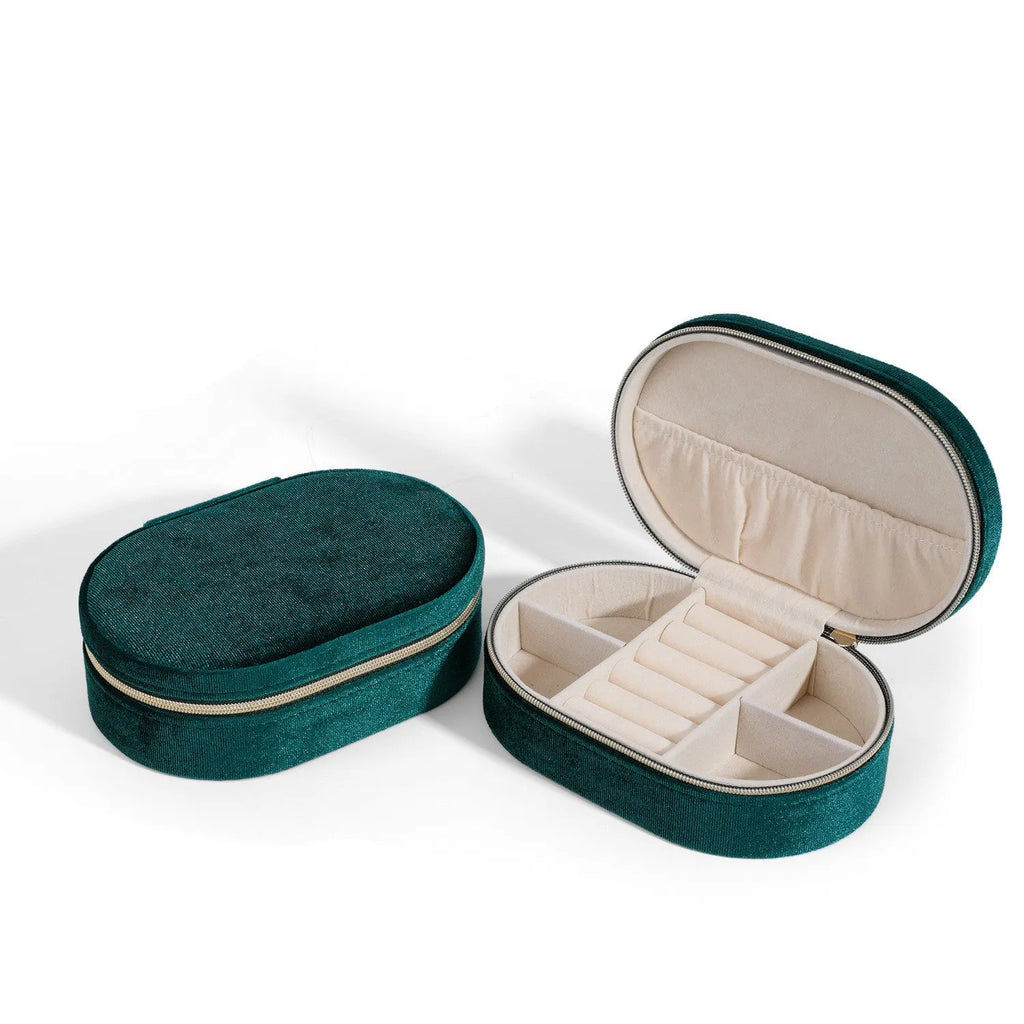Oval velvet jewellery box in lake blue colour with flannel lining, showing 15x10x5 cm dimensions