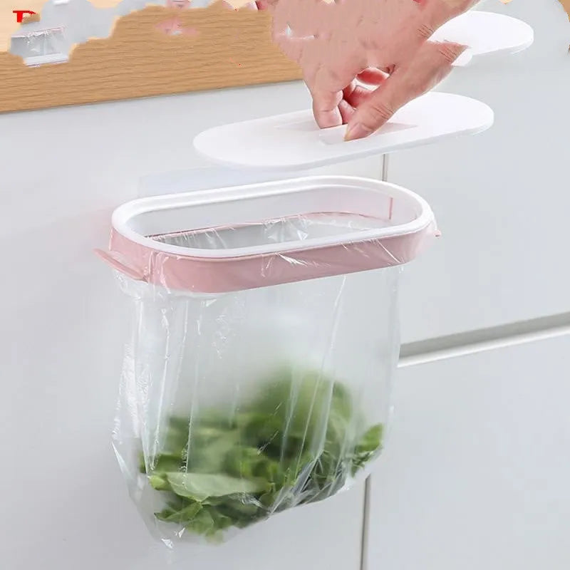 A blue plastic garbage bag storage rack mounted inside a kitchen cabinet door.