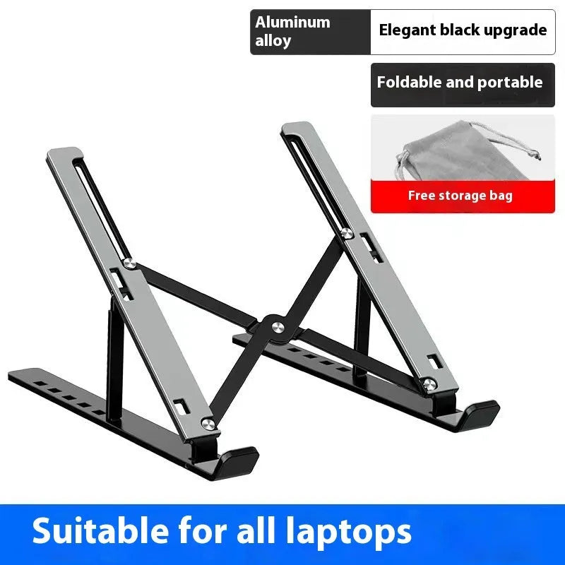 Silver aluminium alloy folding laptop stand with black silicone pads on a wooden desk.