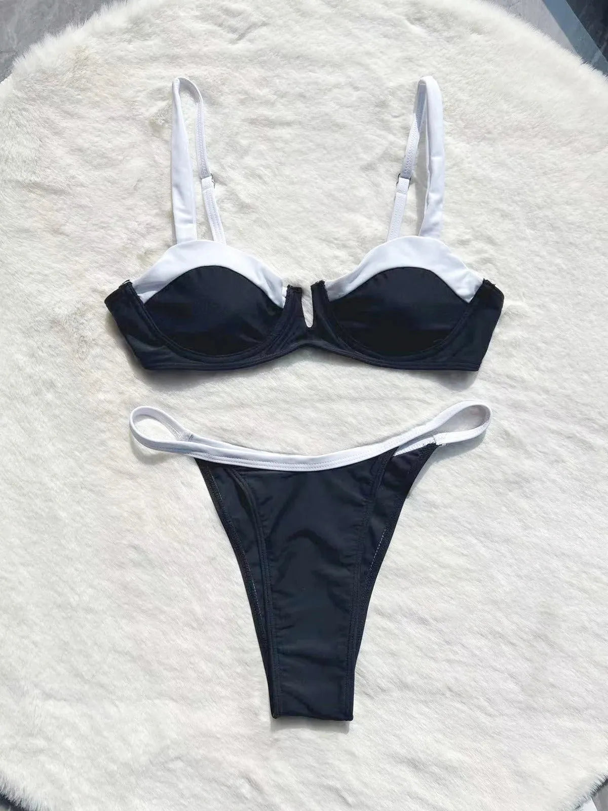 Black low waist women's bikini swimsuit with stitching detail and split briefs design