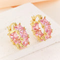 Gold electroplated copper earrings with geometric U-shape design and zircon crystals
