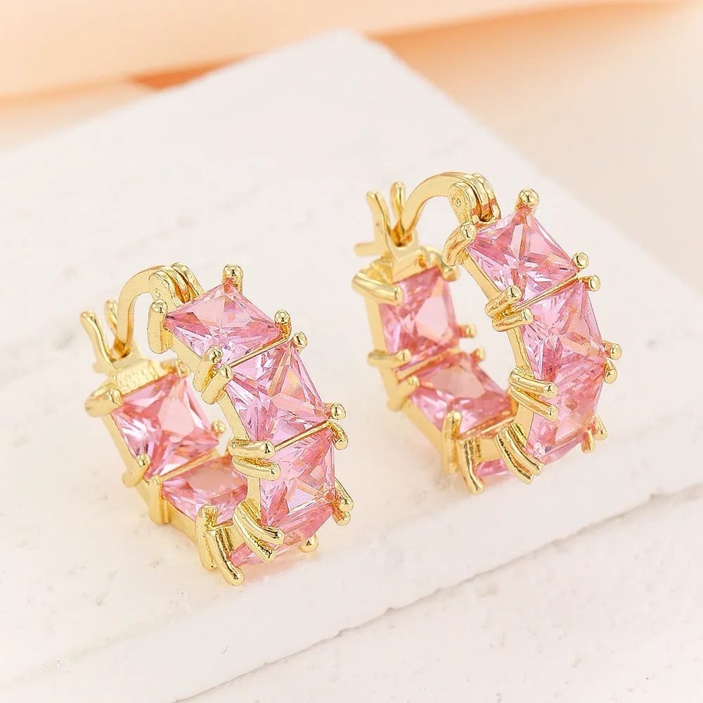 Gold electroplated copper earrings with geometric U-shape design and zircon crystals