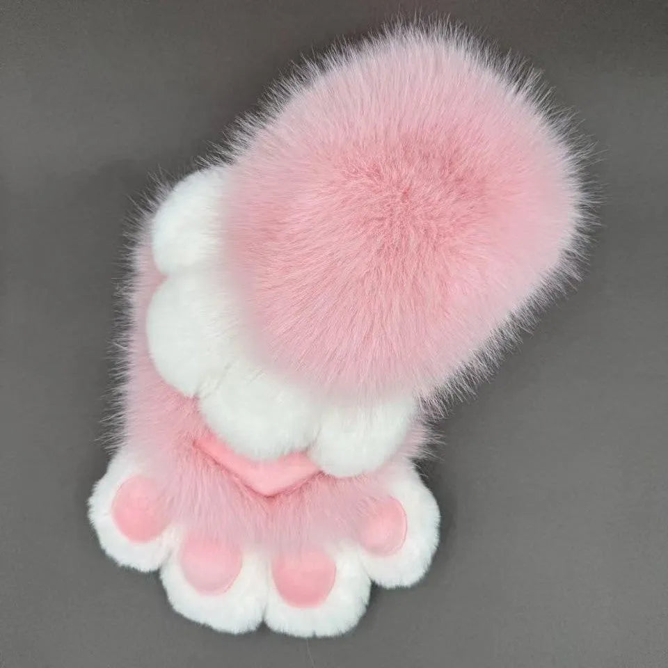 A pair of fingerless animal claw cosplay gloves in a white and pink colour combination with a coloured pad on the back.