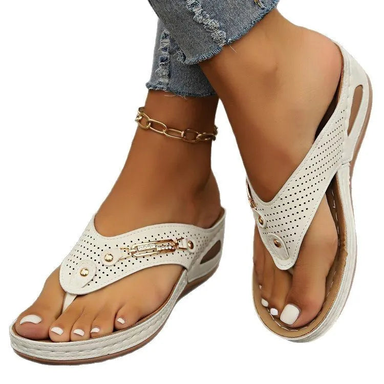 Women's beige retro flip-flops with a herringbone footbed and strap, shown from above.
