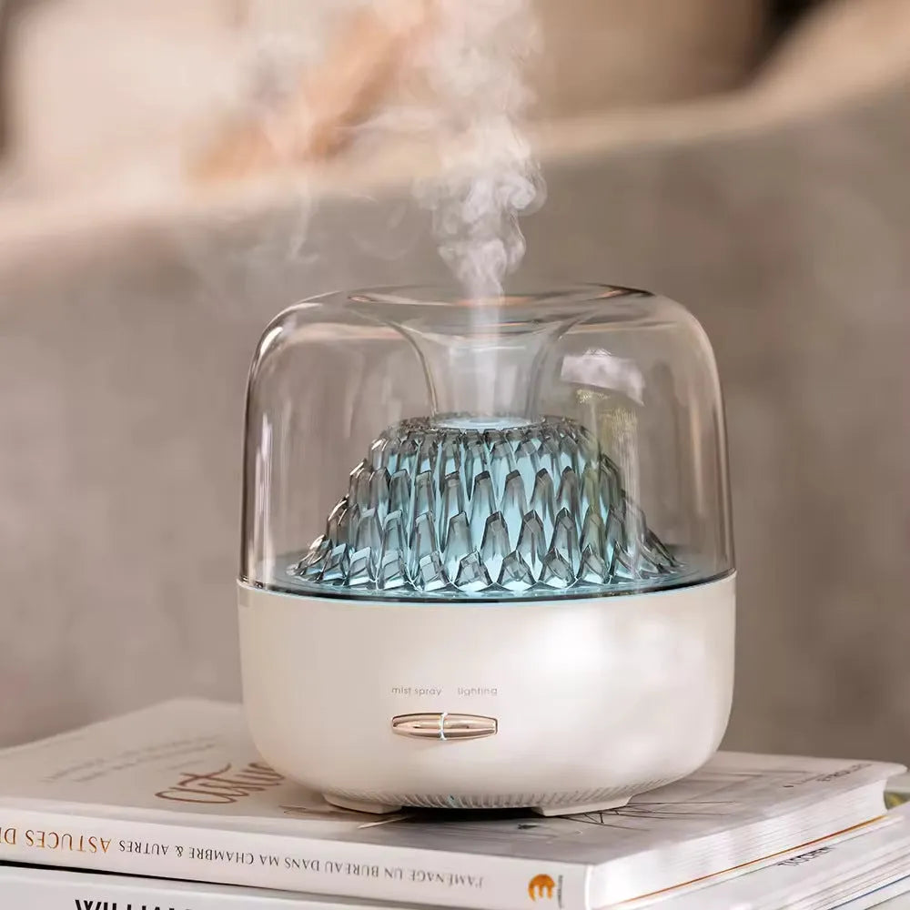 Round resin aroma diffuser with colourful light in beige, on a desktop, with a single fog nozzle
