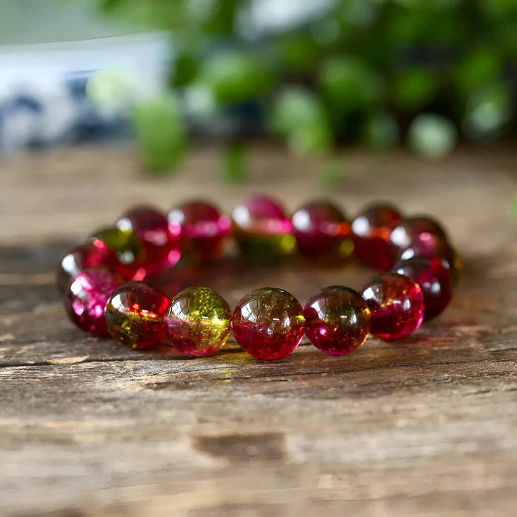 Women's watermelon-coloured crystal bracelet with pastoral design, shown in different size options.