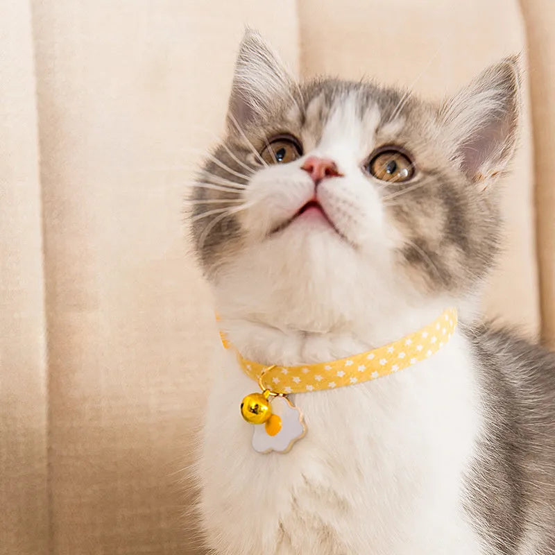 Adjustable cat collar with metal bell pendant and fabric bow tie in three colour options
