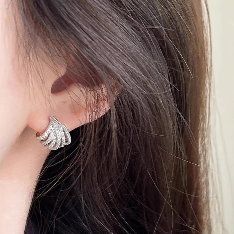 Geometric zircon earrings with platinum electroplated finish and clean line design