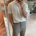 Man wearing a slim-fit black short-sleeved ice silk knitted shirt.