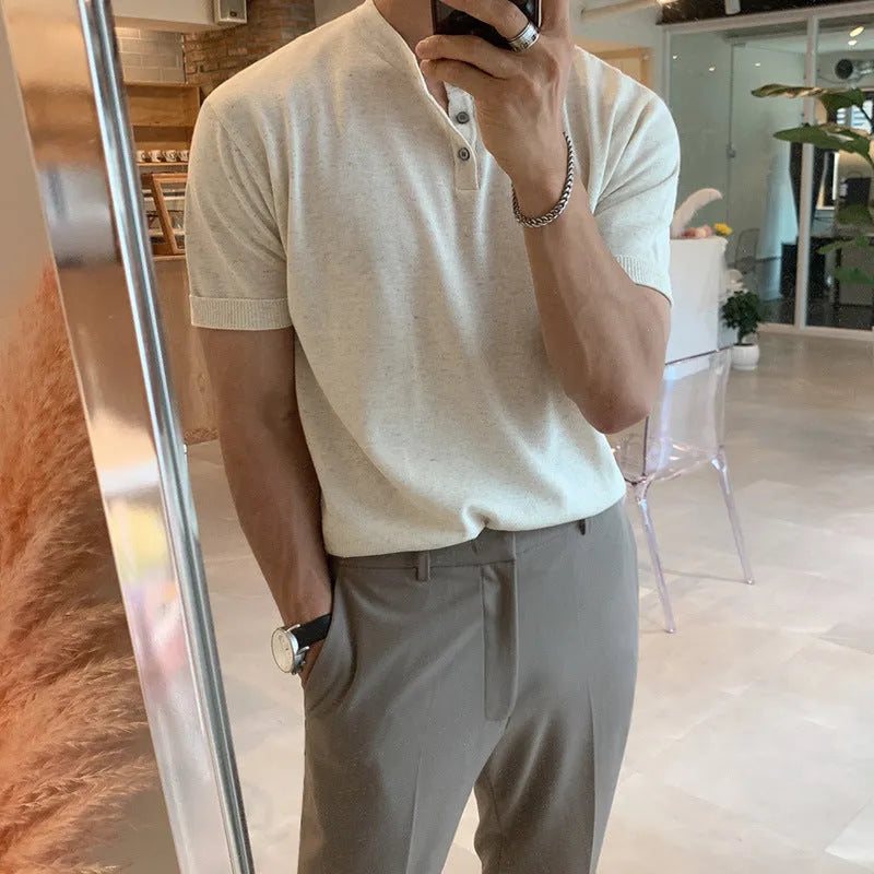 Man wearing a slim-fit black short-sleeved ice silk knitted shirt.