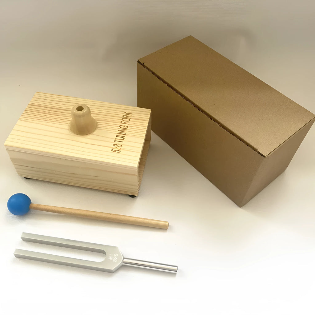 Aluminium alloy 432Hz tuning fork with speaker on kraft paper box background