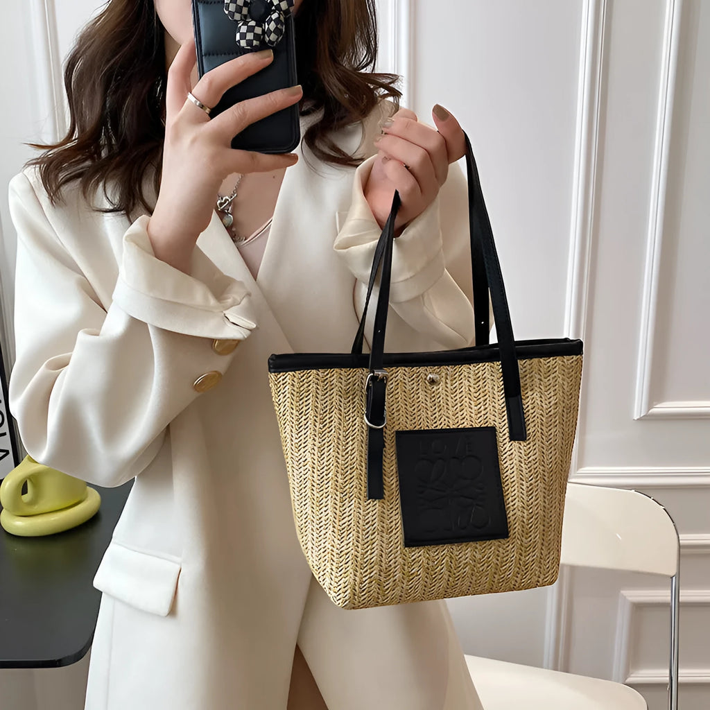 Straw woven women's shoulder bag in black with three-dimensional pocket and 27cm width
