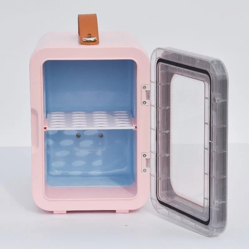 Pink mini refrigerator with transparent door showing interior storage for cosmetics