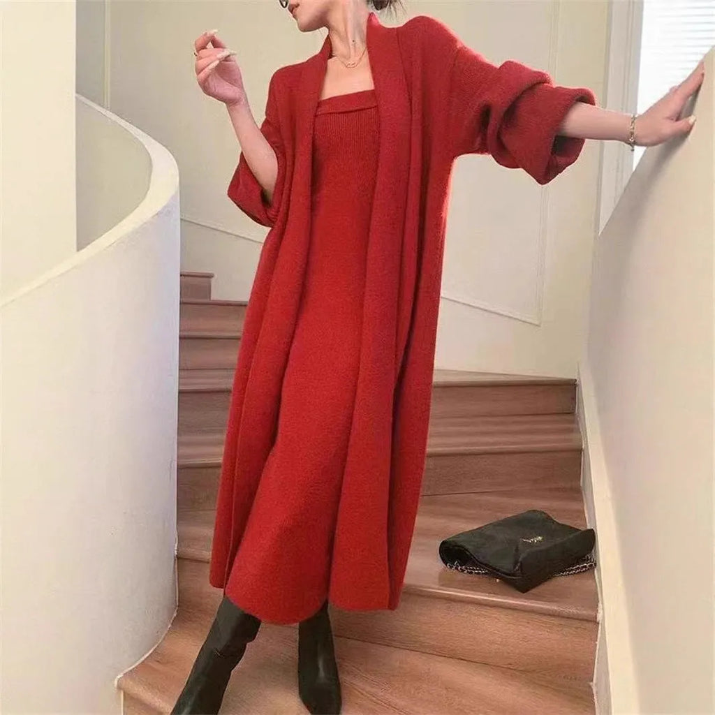 Women's gray knitted cardigan dress suit set with long skirt and regular sleeves.