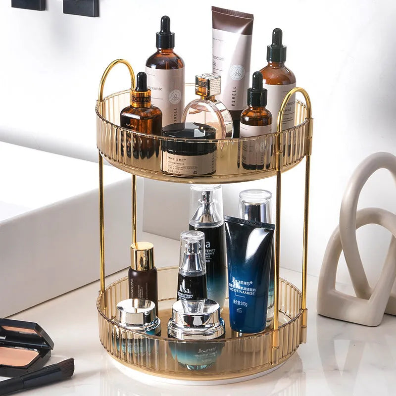 Three-layer rotating bathroom cosmetics storage rack in green, yellow, and white on a desktop