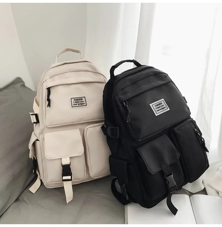 Black nylon student backpack with laptop compartment and front pocket