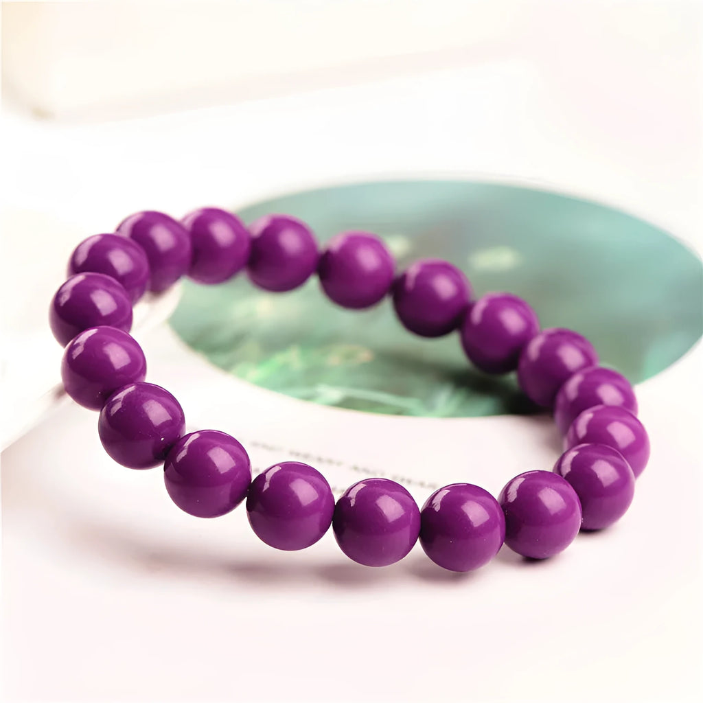 Polished purple mica crystal bracelet with original design on a wrist, showing 5A colour grade.