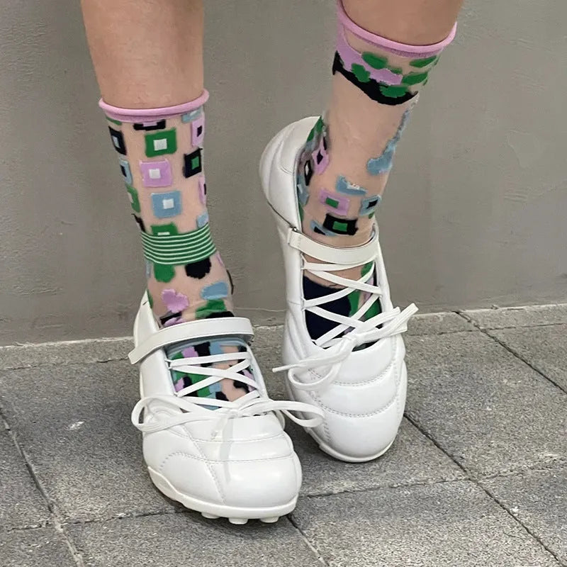 Women's silver lace-up sports-style heeled shoe with a bow detail and round toe.