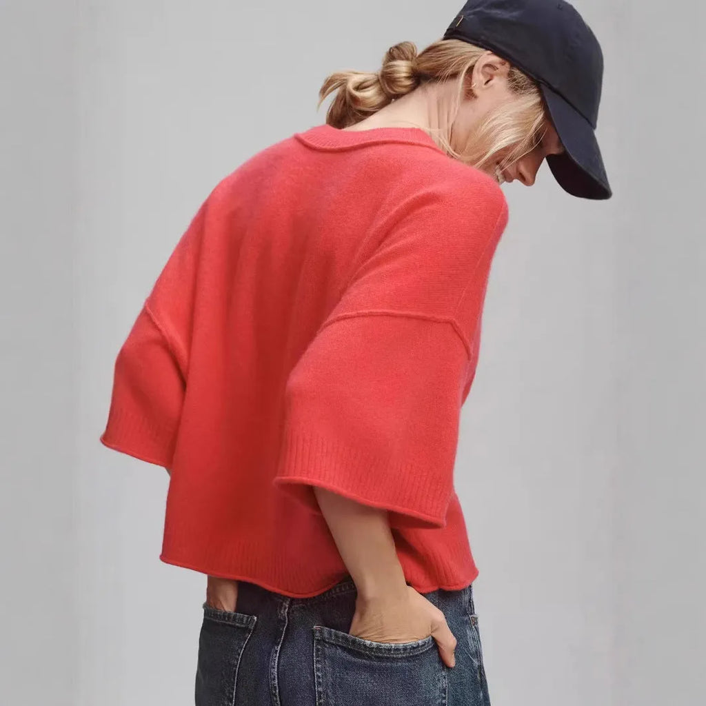 Red women's short viscose T-shirt with an exposed navel design on a model