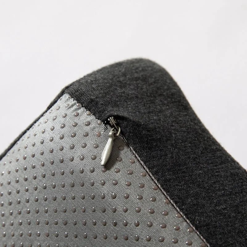 Dark grey memory foam office chair cushion with lumbar support, shown on a black desk chair.