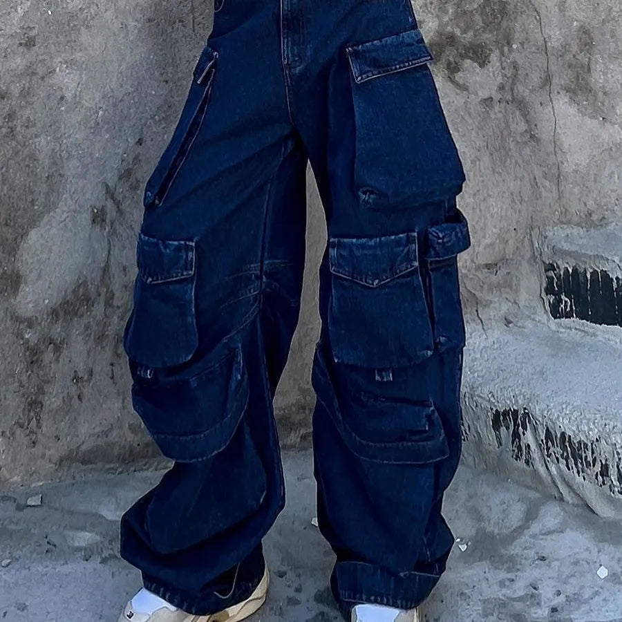 Dark blue distressed wide-leg jeans with a high waist and multiple pockets on a mannequin.