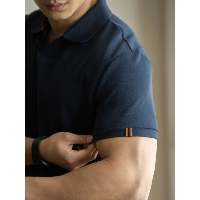 American-style short-sleeved polo shirt in a blue cotton-polyester blend on a hanger.