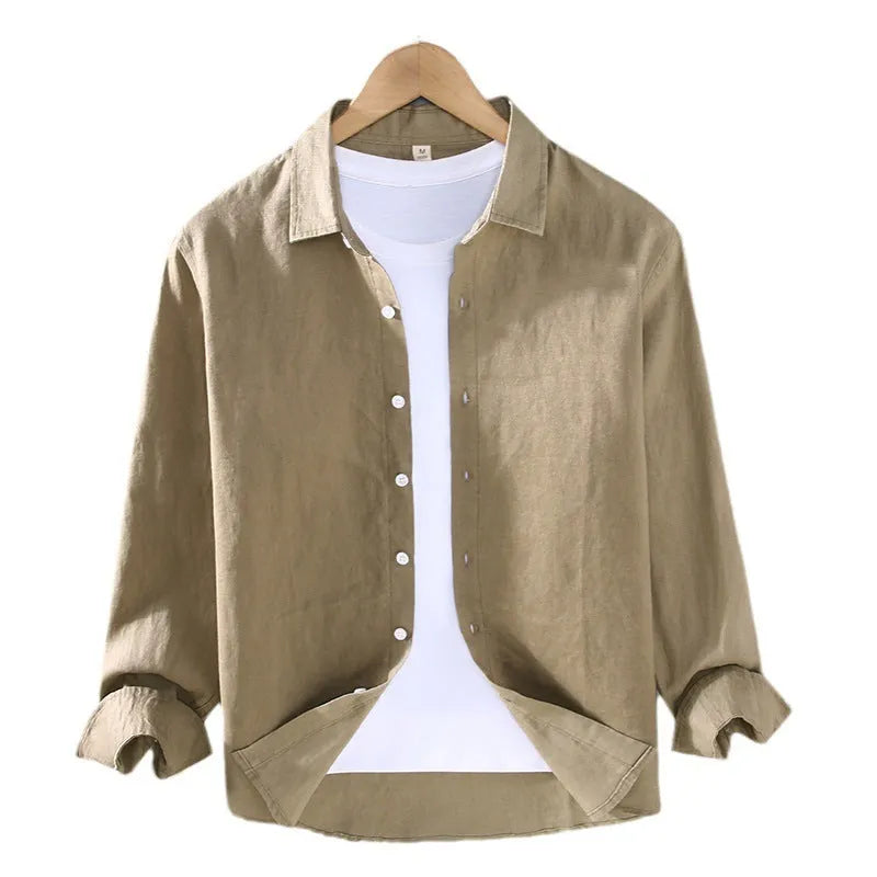 Man wearing a simple solid-colour linen cardigan-style shirt with long sleeves.