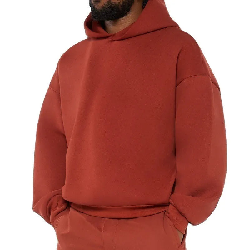 Men's grey fleece-lined pullover hoodie with wool lining shown in casual wear