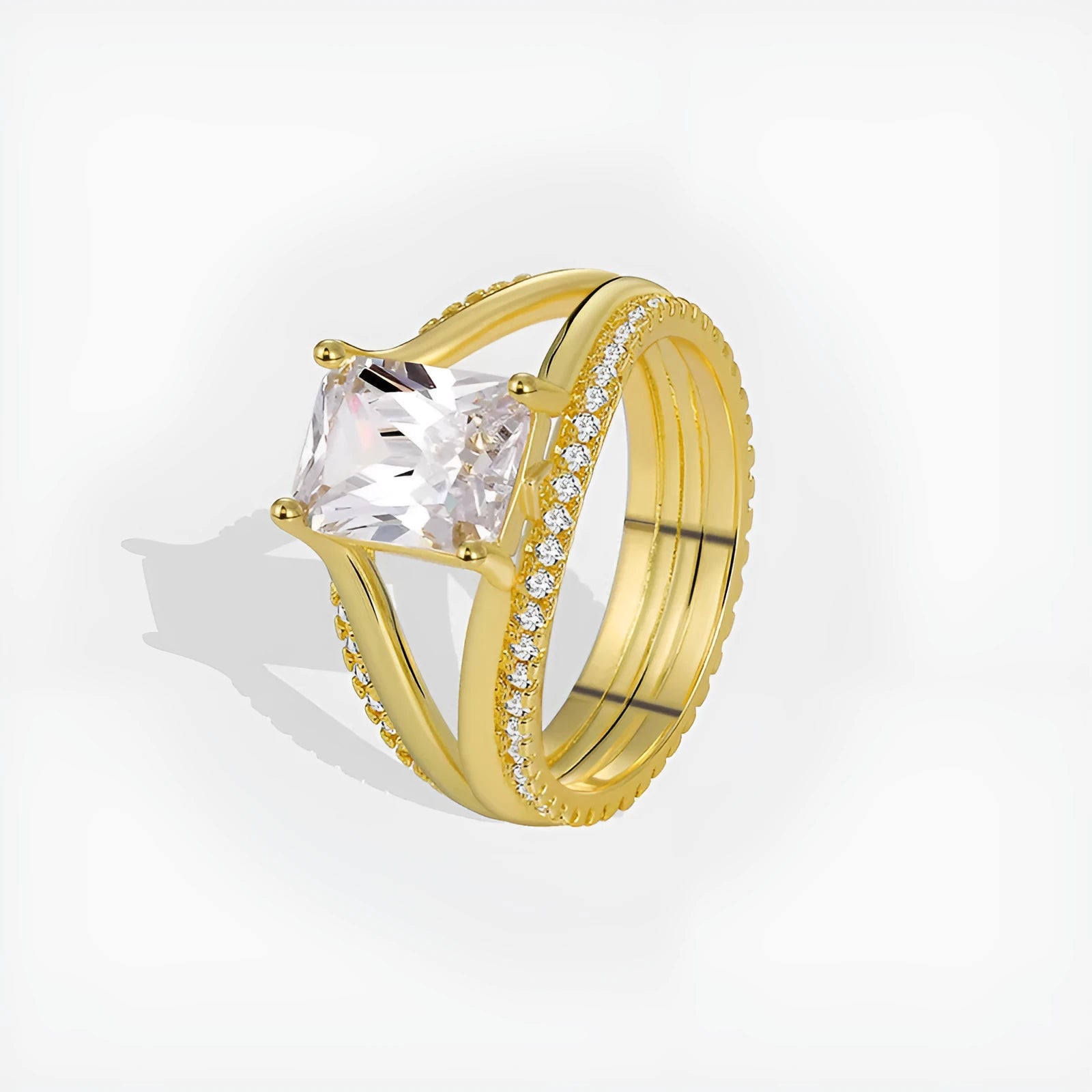 Geometric gold-coloured women's ring with a square zircon stone on a copper band.