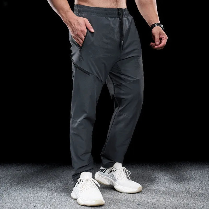 Men's waterproof quick-drying nylon workout trousers with elasticated mid-waist in multiple colour options