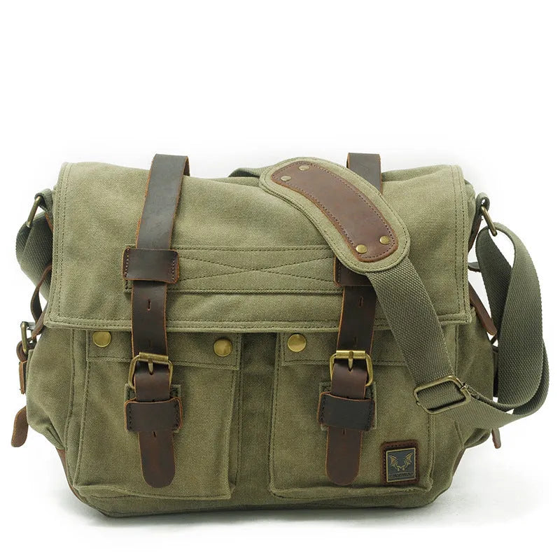 Men's brown canvas crossbody shoulder bag with leather trim shown open, revealing internal organiser pockets.