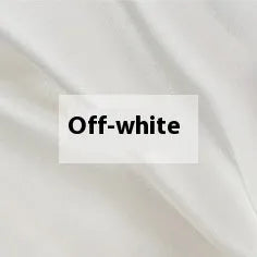 Double-sided silk duvet cover in a solid colour, shown in bright brown on a bed.