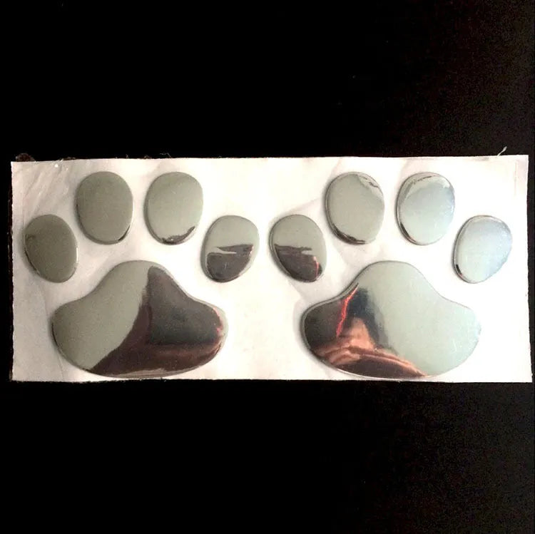 Pair of 7cm long PVC car stickers with a hand-shaped brush and dog footprints design in black, red, silver, and gold colour options.