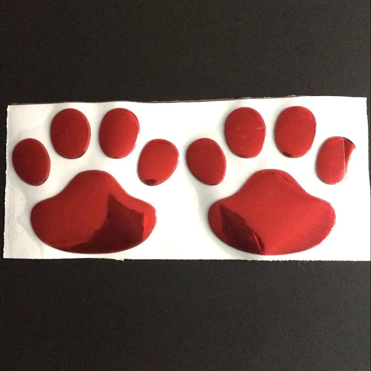 Pair of 7cm long PVC car stickers with a hand-shaped brush and dog footprints design in black, red, silver, and gold colour options.