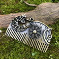 Bronze double-sided Viking rune comb with dragon motif on neutral background
