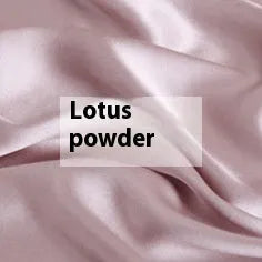 Double-sided silk duvet cover in a solid colour, shown in bright brown on a bed.