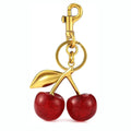 Three-dimensional cherry key ring in zinc alloy available in pink or red colours