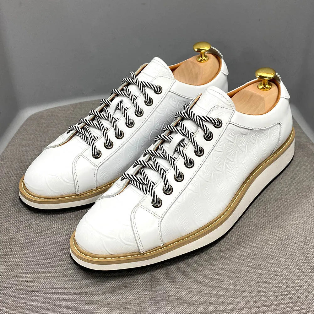 Men's low-top leather sneakers with an embossed pattern on the upper, shown in a choice of colours.