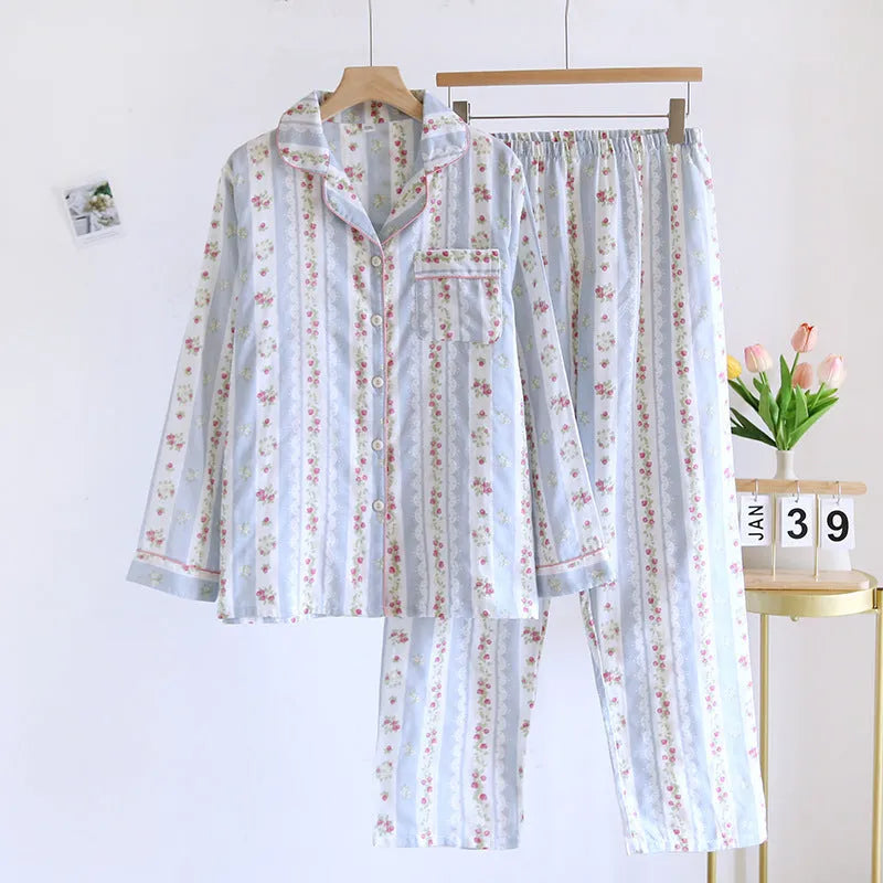 Ladies' long-sleeved cotton gauze homewear set in a striped floral print, showing top and trousers laid flat.