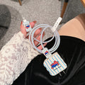 Set of four lambskin adhesive protective sleeves for USB charging cables in cartoon puppy patterns.