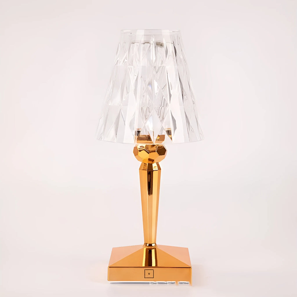 Rose gold portable touch projection night light with acrylic lamp holder on wooden surface