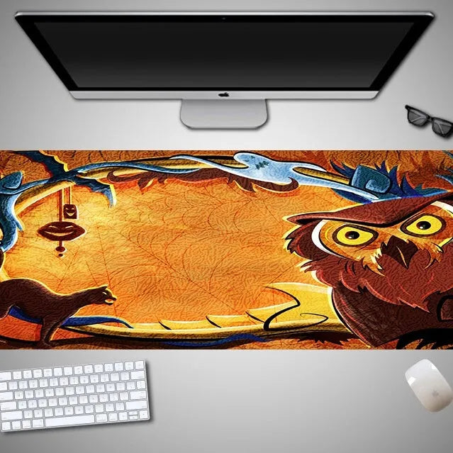 Oversized Halloween-themed gaming mouse pad with non-slip base on a desk.
