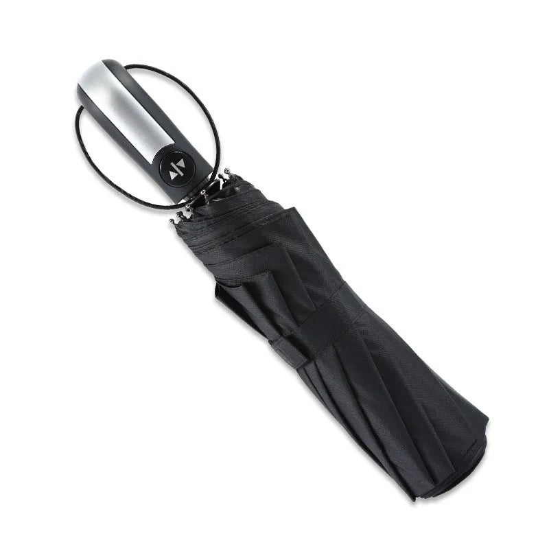 Black automatic open triple folding business umbrella with 10 ribs, shown in open position.