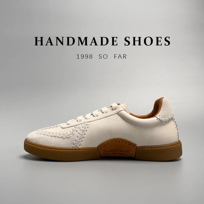 Men's beige genuine leather low-cut sneakers with white lace-up front and rubber sole on neutral background
