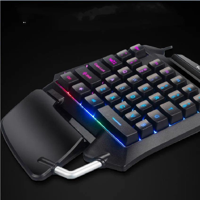 Black one-handed gaming keyboard with programmable shortcut keys and integrated hand rest for left-handed battle royale gamers