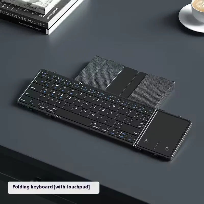 Black folding Bluetooth keyboard unfolded showing full keyboard layout with optional touchpad accessory